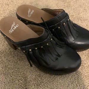 Black fringe clogs